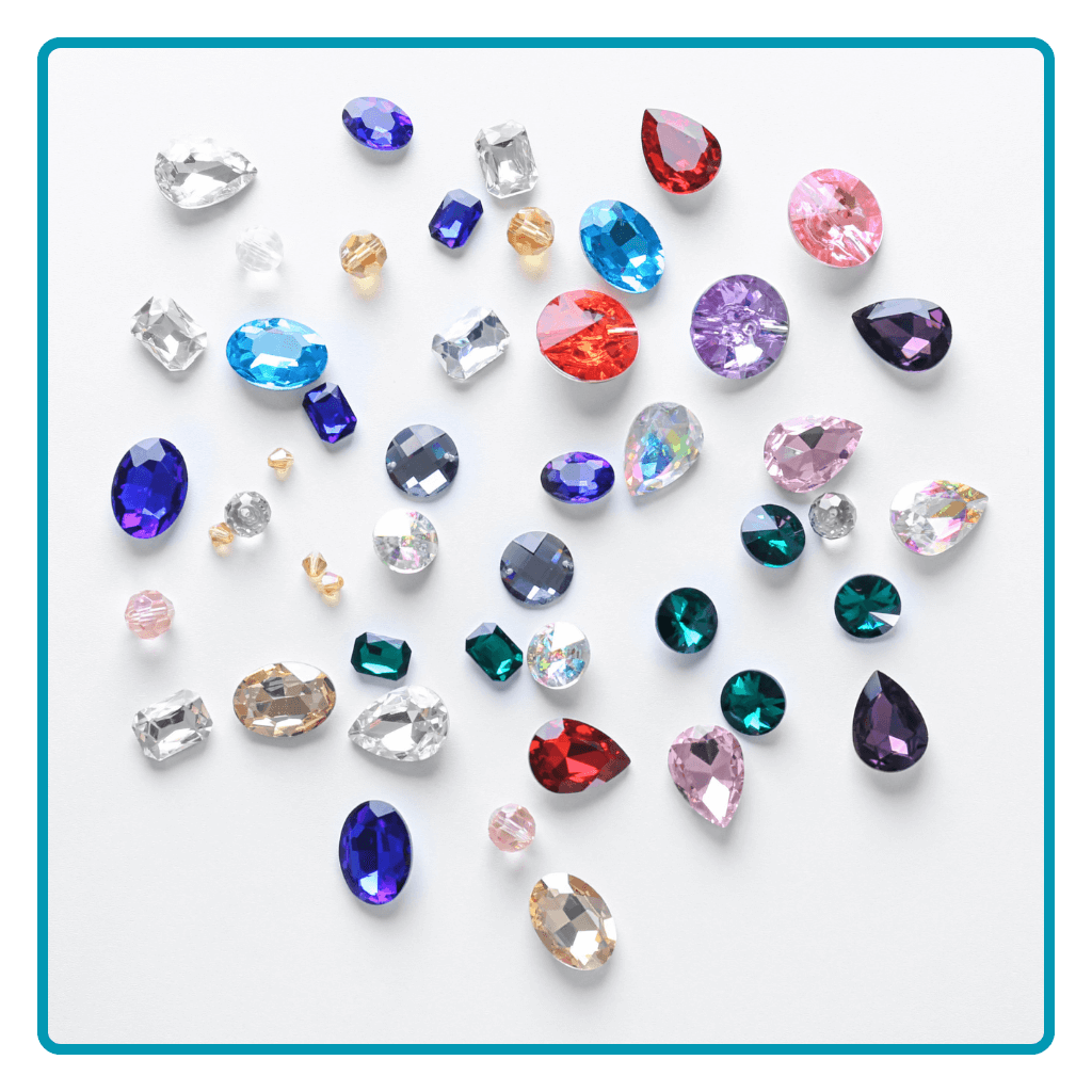 A variety of colourful gemstones in different shapes and sizes